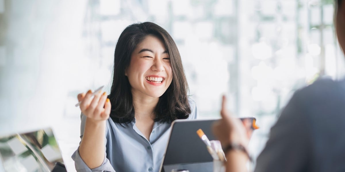 woman smiling, in office