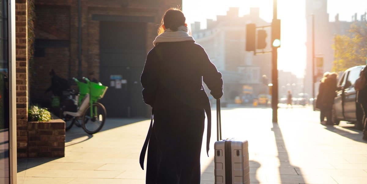 traveler in city with luggage